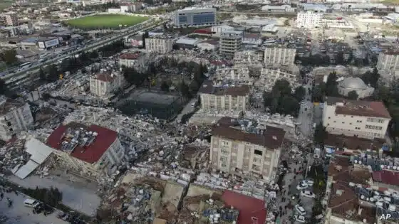 Aerial photo shows the destruction in Hatay city center, southern Turkey, Tuesday, Feb. 7, 2023. Search teams and emergency aid from around the world poured into Turkey and Syria on Tuesday as rescuers working in freezing temperatures dug — sometimes with their bare hands — through the remains of buildings flattened by a magnitude 7.8 earthquake. The death toll soared above 5,000 and was still expected to rise. of collapsed buildings across the region. (IHA via AP)